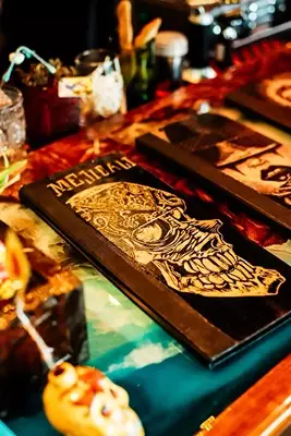 A picture of several menus on the bar at Mejicali Bar